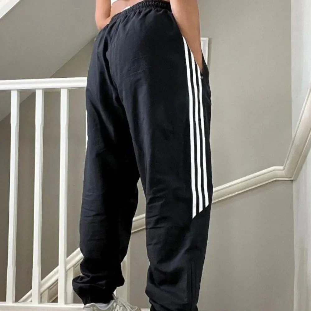 Adidas Baggy Fit Cuffed Leg Tracksuit Windpants unisex Black with white stripes